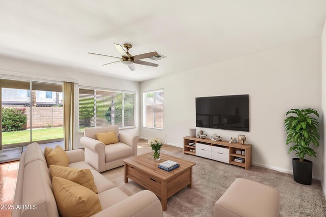 664 E Windsor Dr, Gilbert, AZ 85296 - living area featuring plenty of natural light, a ceiling fan, light carpet, and baseboards
