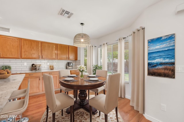 664 E Windsor Dr, Gilbert, AZ 85296 - dining space with light wood-style flooring