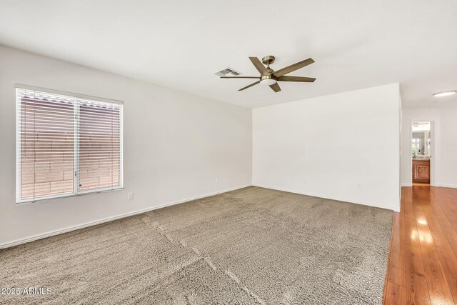 664 E Windsor Dr, Gilbert, AZ 85296 - spare room featuring ceiling fan and baseboards