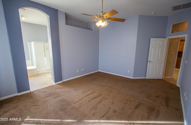 spare room with light carpet and ceiling fan