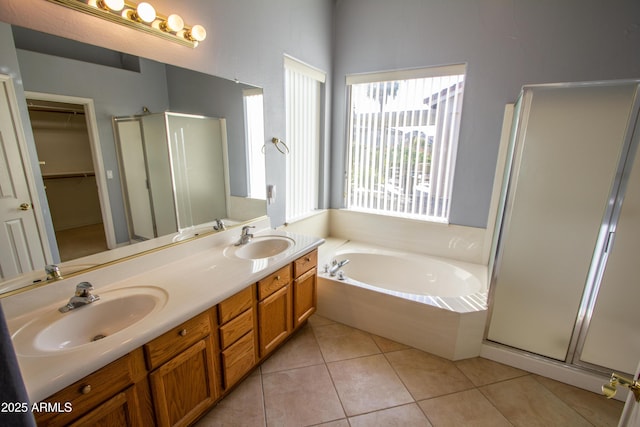 bathroom featuring tile patterned floors, vanity, and plus walk in shower