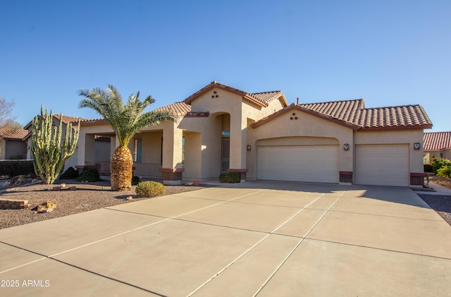 mediterranean / spanish house featuring a garage