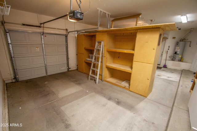 garage featuring water heater and a garage door opener