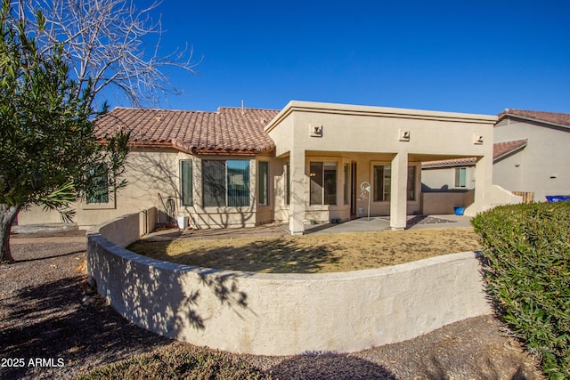 back of house with a patio