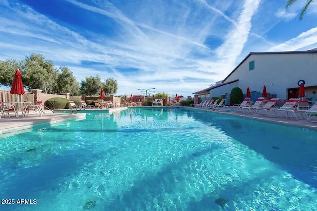 view of swimming pool with a patio area