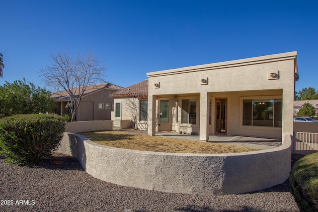 rear view of house with a patio