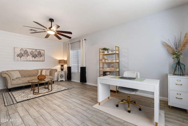 office space with light wood-type flooring and ceiling fan