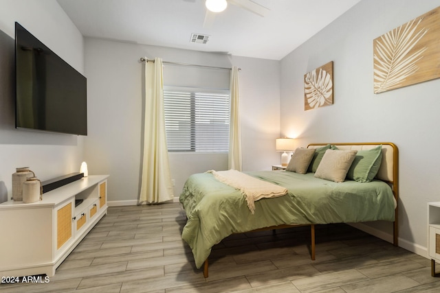 bedroom featuring light wood-type flooring and ceiling fan