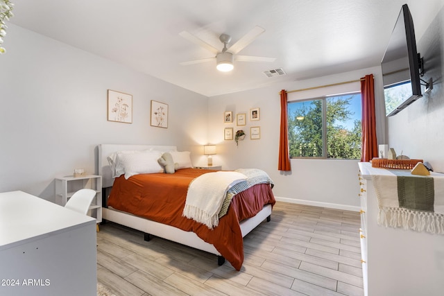 bedroom with ceiling fan and light hardwood / wood-style floors