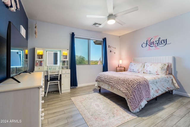 bedroom featuring light hardwood / wood-style floors and ceiling fan