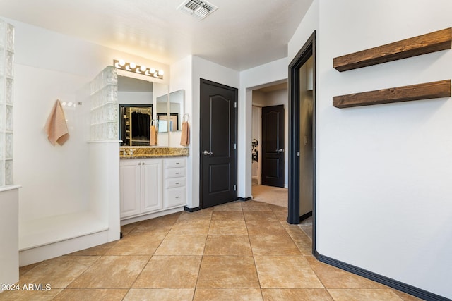 bathroom with vanity and tile patterned floors