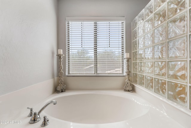 bathroom featuring a tub to relax in