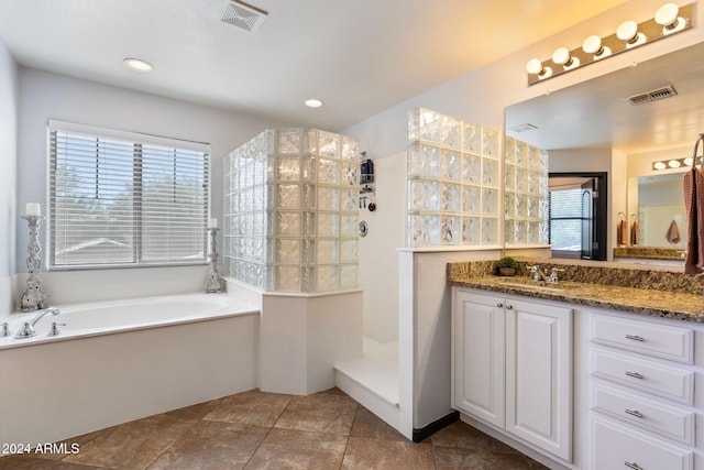 bathroom with vanity, tile patterned floors, separate shower and tub, and plenty of natural light