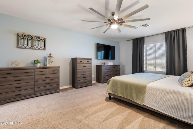 bedroom with ceiling fan and light colored carpet