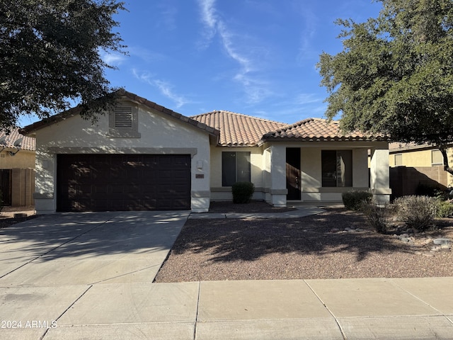 mediterranean / spanish house featuring a garage