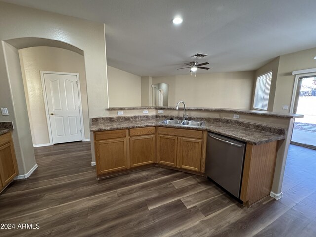 kitchen featuring dark hardwood / wood-style flooring, ceiling fan, sink, and stainless steel dishwasher