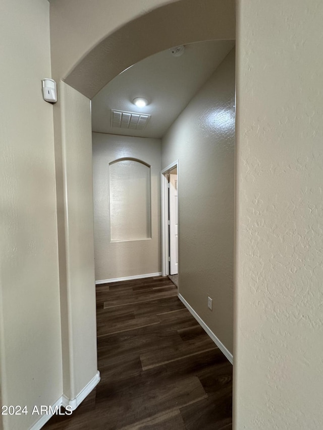 corridor featuring dark hardwood / wood-style flooring