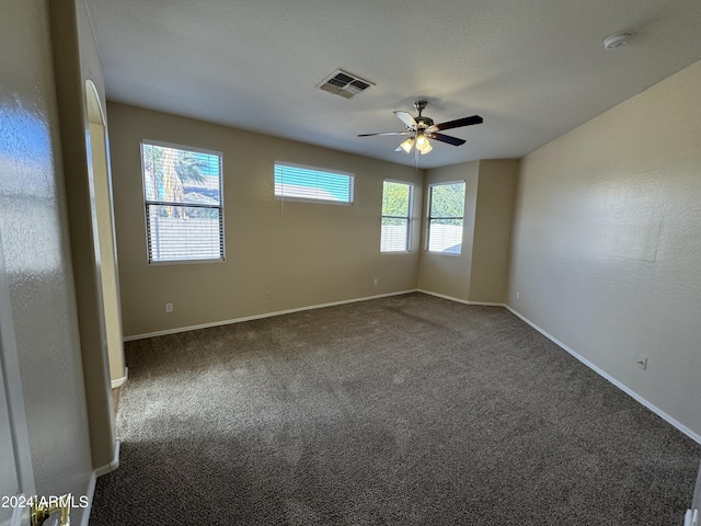 carpeted empty room with ceiling fan