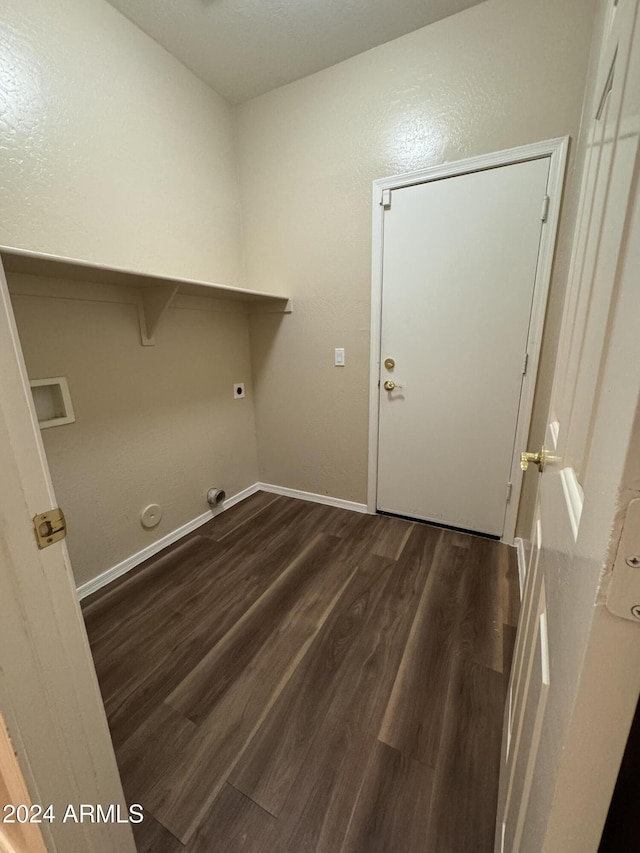 clothes washing area with hookup for an electric dryer, hookup for a gas dryer, and dark hardwood / wood-style flooring