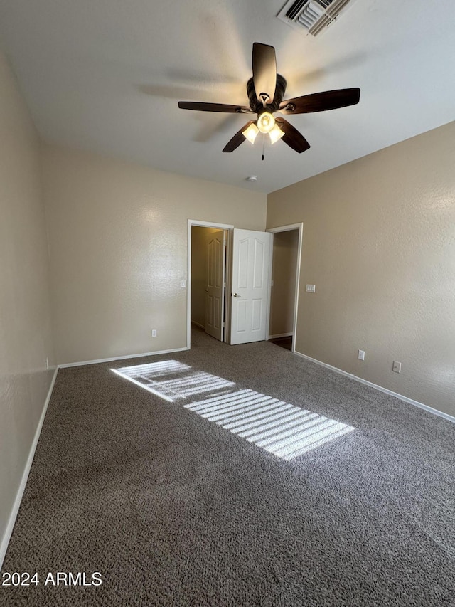 unfurnished bedroom featuring ceiling fan and carpet floors