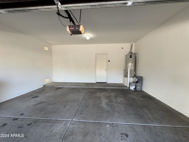 garage featuring a garage door opener and water heater