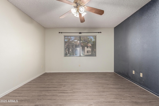 2146 W Isabella Ave Unit 131, Mesa, AZ 85202 - unfurnished room with baseboards, a ceiling fan, wood finished floors, and a textured ceiling