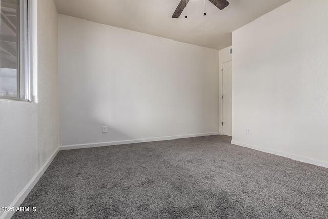 empty room with baseboards, a ceiling fan, and carpet