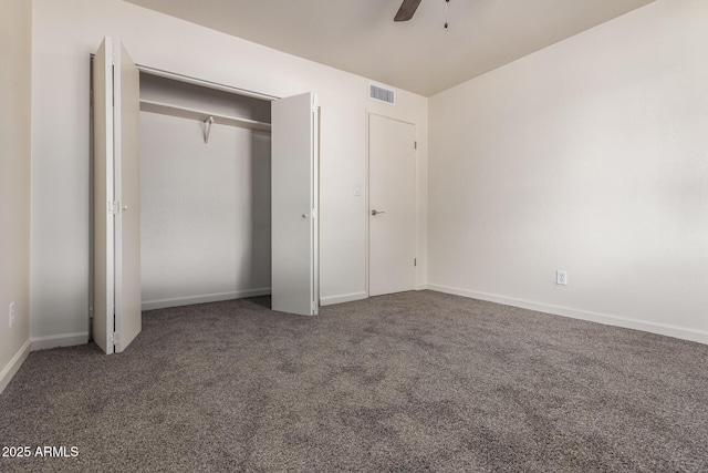 unfurnished bedroom featuring visible vents, a closet, carpet, baseboards, and ceiling fan