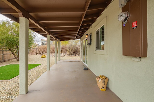 view of patio featuring fence