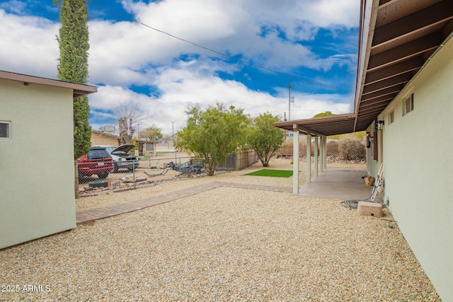 view of yard featuring a patio and fence