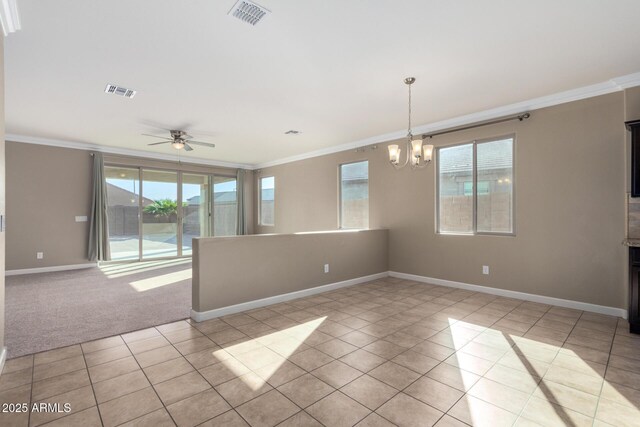 23789 W Chipman Rd, Buckeye, AZ 85326 - unfurnished room featuring light tile patterned floors, ornamental molding, visible vents, and plenty of natural light