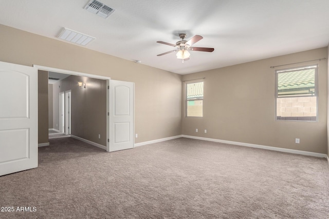 23789 W Chipman Rd, Buckeye, AZ 85326 - carpeted spare room featuring visible vents, baseboards, and ceiling fan