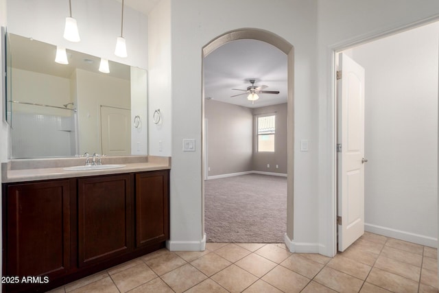 23789 W Chipman Rd, Buckeye, AZ 85326 - bathroom with a ceiling fan, vanity, baseboards, and tile patterned flooring