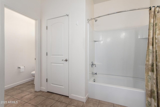 23789 W Chipman Rd, Buckeye, AZ 85326 - bathroom with toilet, tile patterned floors, shower / tub combo, and baseboards
