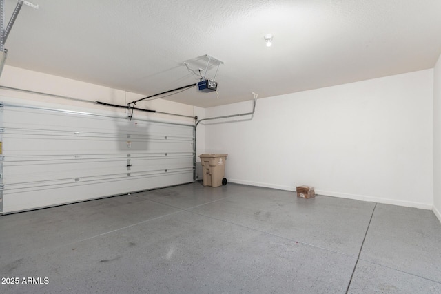 23789 W Chipman Rd, Buckeye, AZ 85326 - garage with a garage door opener and baseboards