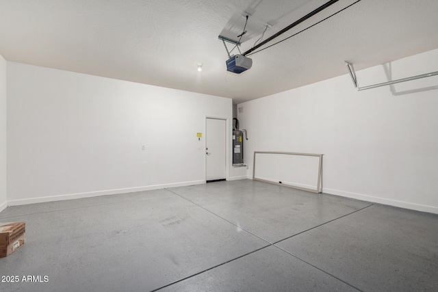 23789 W Chipman Rd, Buckeye, AZ 85326 - garage with water heater, baseboards, and a garage door opener