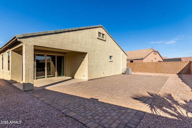 23789 W Chipman Rd, Buckeye, AZ 85326 - rear view of house featuring central AC, a fenced backyard, a patio, and stucco siding