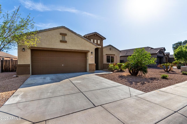 23789 W Chipman Rd, Buckeye, AZ 85326 - view of front of property featuring concrete driveway, stucco siding, a tile roof, a garage, and fence