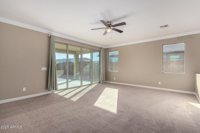 23789 W Chipman Rd, Buckeye, AZ 85326 - carpeted empty room with crown molding, visible vents, baseboards, and a ceiling fan