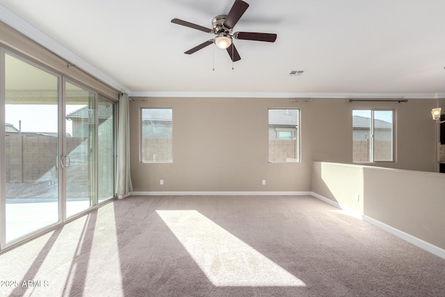 23789 W Chipman Rd, Buckeye, AZ 85326 - unfurnished room with carpet flooring, ornamental molding, visible vents, and a wealth of natural light