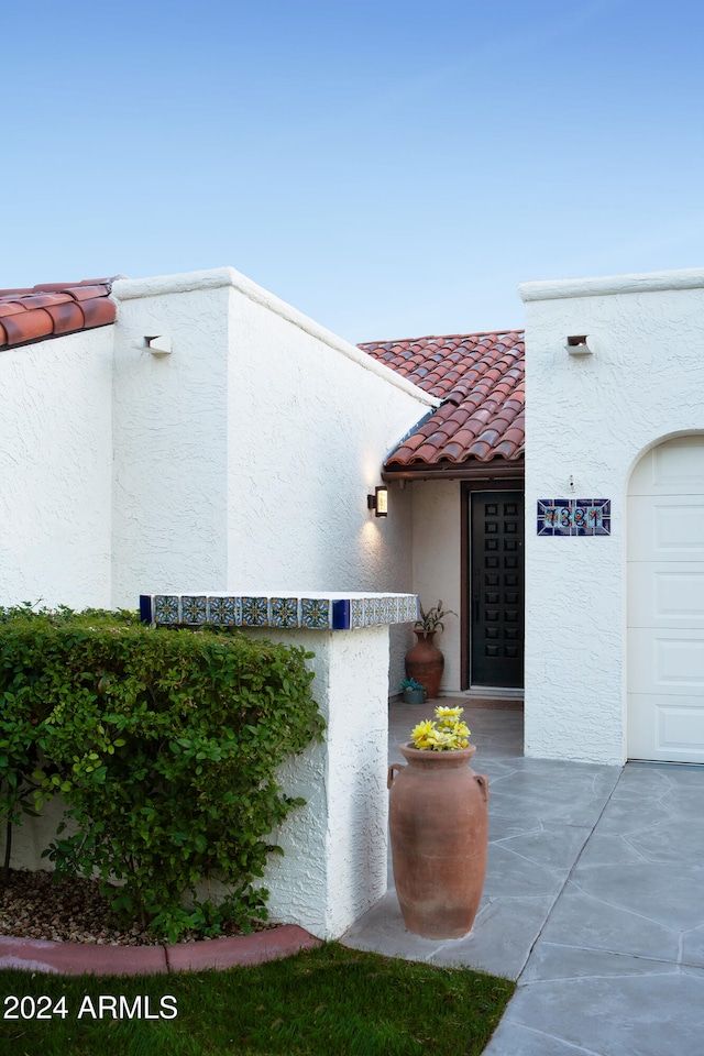 property entrance featuring a garage