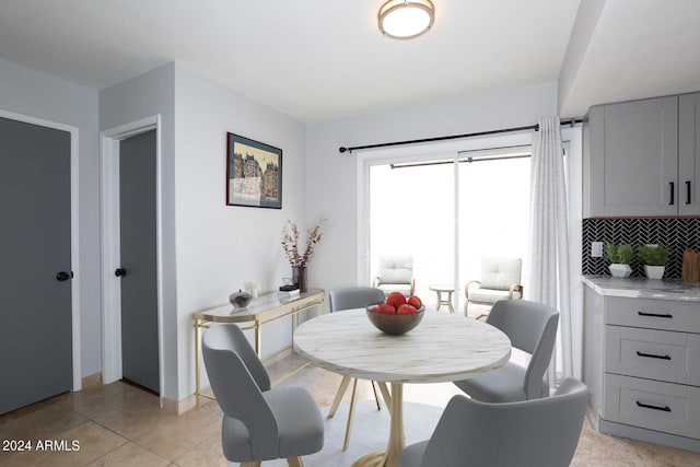 dining area featuring light tile patterned floors