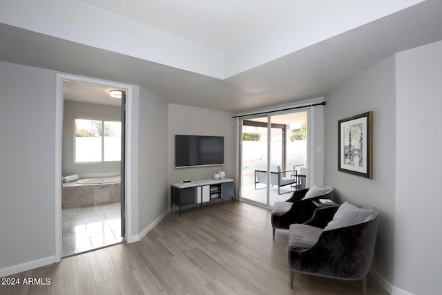 sitting room featuring a healthy amount of sunlight and light wood-type flooring