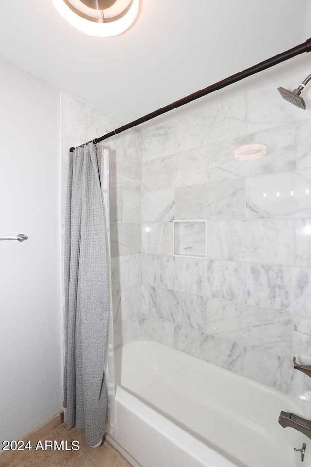 bathroom with shower / tub combo with curtain