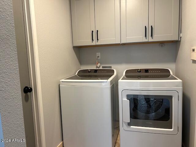 7331 E Valley Vista Dr, Scottsdale, AZ 85250 - laundry room with cabinet space and independent washer and dryer