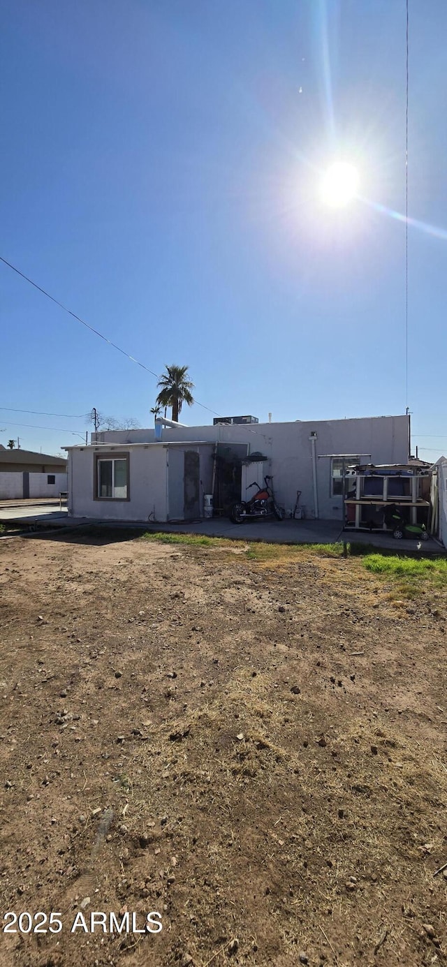 rear view of property with fence