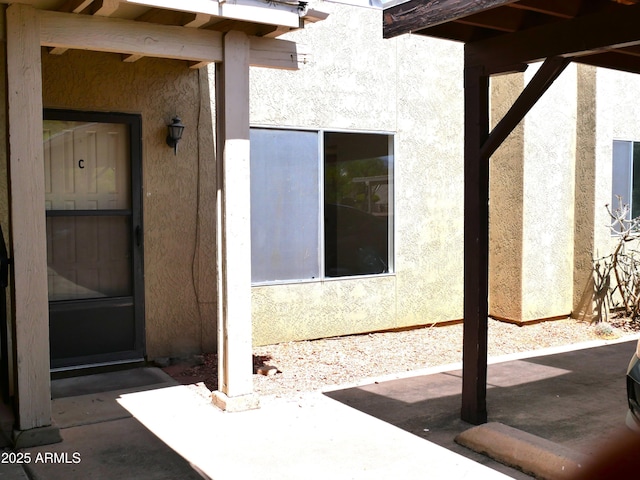 4359 Avenida Palermo Unit C, Sierra Vista, AZ 85635 - view of exterior entry featuring stucco siding and a patio