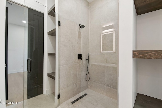 bathroom with a shower stall