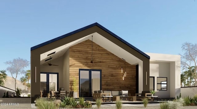 rear view of property featuring ceiling fan, a patio, and stucco siding