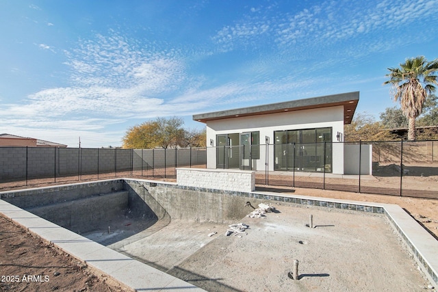 view of pool with a fenced backyard